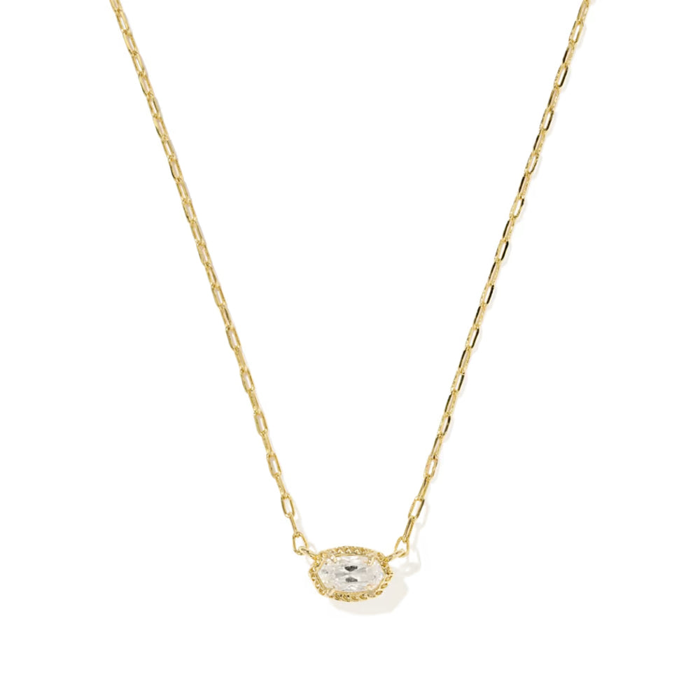 A delicate gold chain necklace featuring an oval pendant with a small clear central stone surrounded by a halo of tiny clear stones, set against a plain white background.