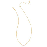 A delicate gold chain necklace with a small oval bezel-set clear gemstone at the center, displayed on a clean white background.