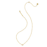 A delicate gold chain necklace with a small oval pendant, displayed on a clean white background.