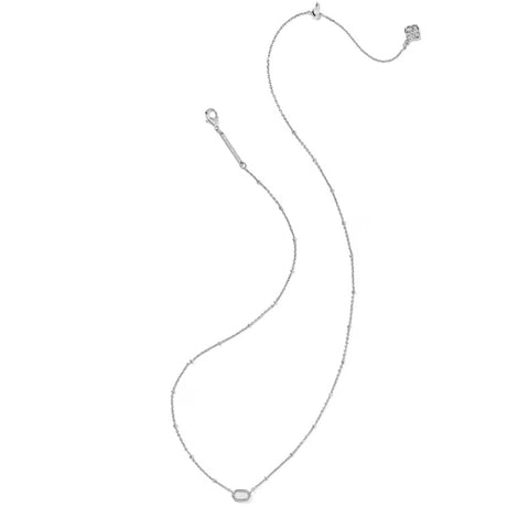 A delicate silver chain necklace with a small oval bezel-set clear gemstone pendant, displayed on a solid white background.