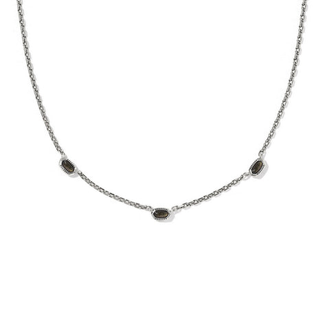 Necklace with small dark stones on a white background