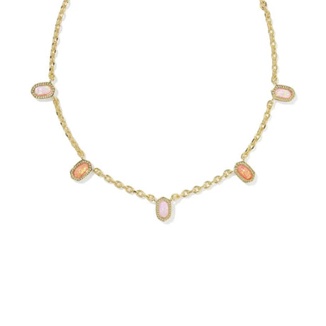 A gold chain necklace featuring five small, oval-shaped pink cabochon gemstones set in gold bezel settings, arranged symmetrically on a plain white background.
