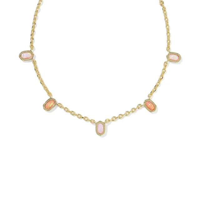 A gold chain necklace featuring five small, oval-shaped pink cabochon gemstones set in gold bezel settings, arranged symmetrically on a plain white background.