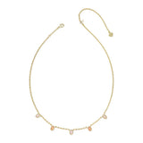 A delicate gold chain necklace featuring five small, oval-cut pale pink gemstones spaced along the front, displayed on a clean white background.