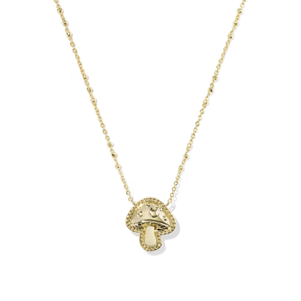 A delicate gold chain necklace featuring a small mushroom-shaped pendant with a textured, beaded border and a polished center, displayed against a clean white background.
