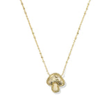A delicate gold chain necklace featuring a small mushroom-shaped pendant with a textured, beaded border and a polished center, displayed against a clean white background.