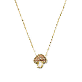 A delicate gold chain necklace featuring a small mushroom-shaped pendant, displayed on a clean white background.