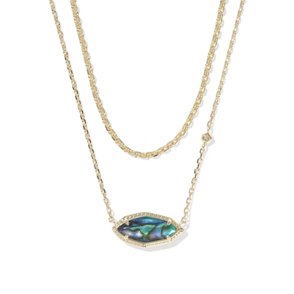 A double-strand gold necklace featuring a textured chain and a central marquise-shaped pendant with an iridescent abalone shell inlay and a small clear crystal accent.