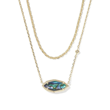 A double-strand gold necklace featuring a textured chain and a central marquise-shaped pendant with an iridescent abalone shell inlay and a small clear crystal accent.