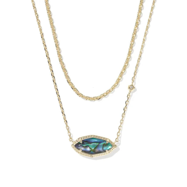 A double-strand gold necklace featuring a textured chain and a central marquise-shaped pendant with an iridescent abalone shell inlay and a small clear crystal accent.