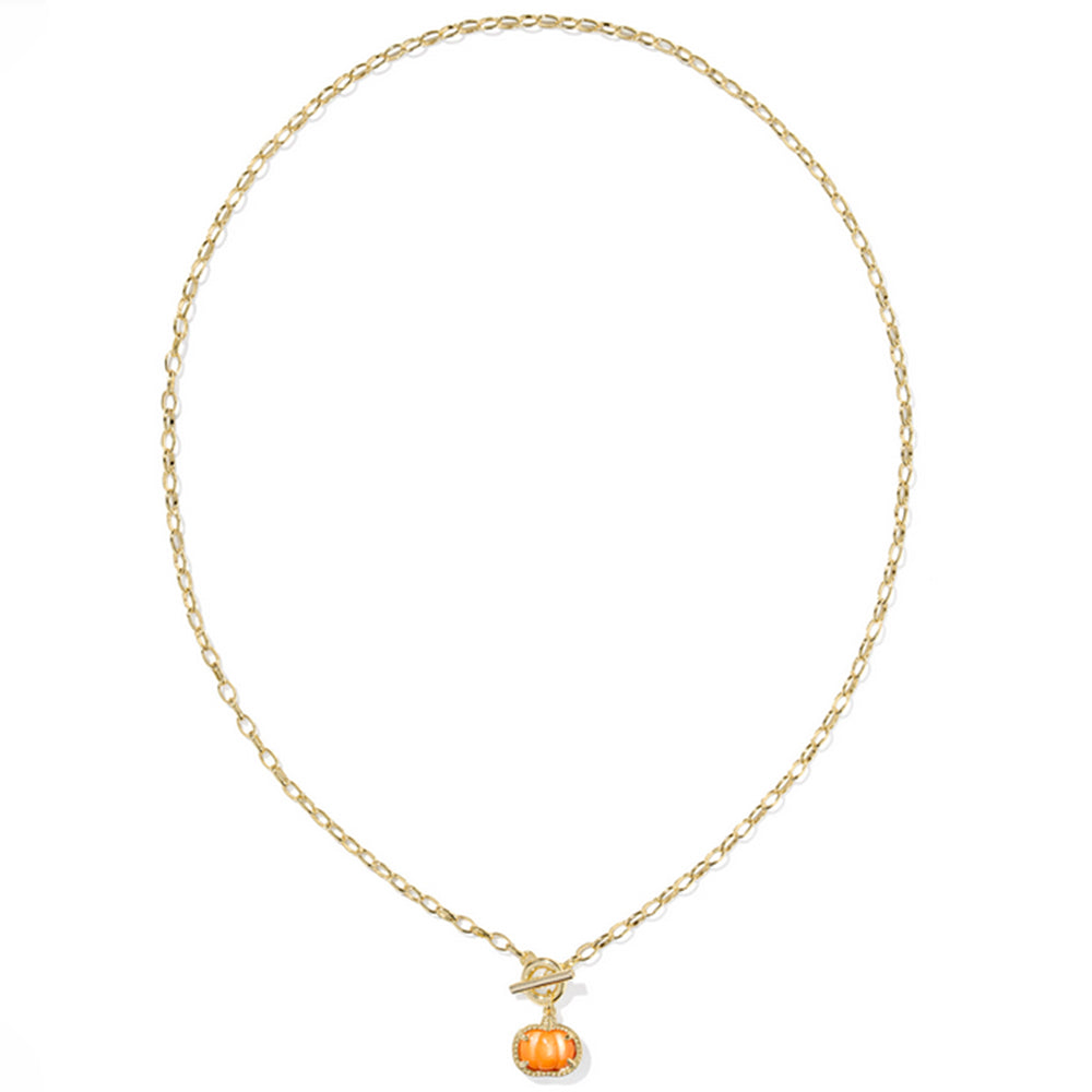 Gold necklace with a small pumpkin pendant on a white background