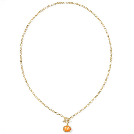 Gold necklace with a small pumpkin pendant on a white background