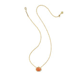 A delicate gold chain necklace featuring a small, textured orange pumpkin pendant with a clear crystal halo, displayed on a solid white background.