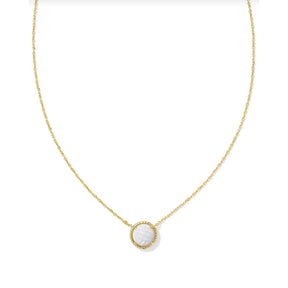 A gold-colored necklace with a short pendant featuring a white mother of pearl in a circular design.