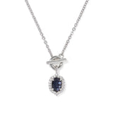 A silver chain necklace with a toggle clasp and a teardrop-shaped pendant featuring a dark blue oval gemstone surrounded by small clear stones, shown on a plain white background.