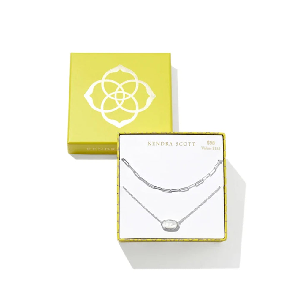 A Kendra Scott 50m double-strand silver necklace set in its white and yellow gift packaging, displayed on a clean white background.