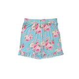A pair of girls' shorts featuring a light blue background with a pink and white floral print, complete with a ruffled hem and elastic waistband.