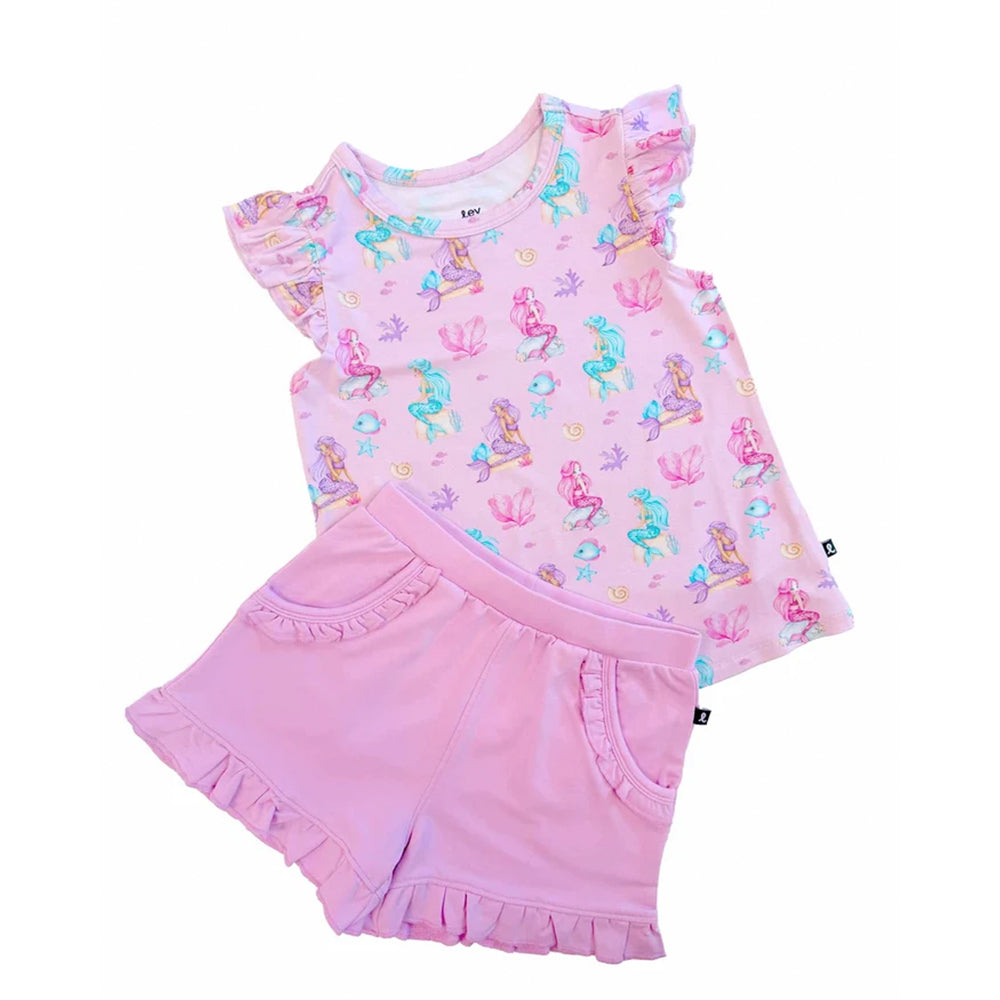 A two-piece girls' outfit set featuring a light pink short-sleeve top with colorful mermaid prints and matching ruffled shorts, displayed on a clean white background.