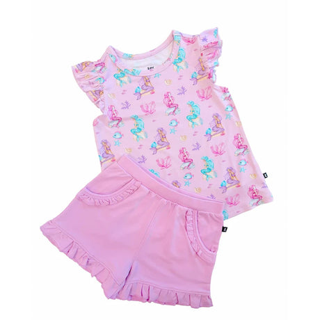 A two-piece girls' outfit set featuring a light pink short-sleeve top with colorful mermaid prints and matching ruffled shorts, displayed on a clean white background.