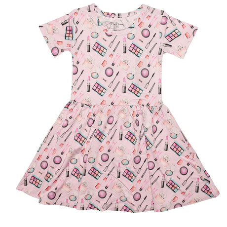 Pink dress with makeup pattern on a white background