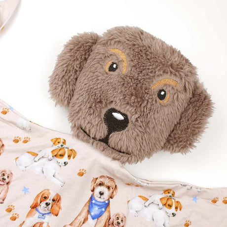 Plush dog toy with a patterned blanket featuring dog illustrations.