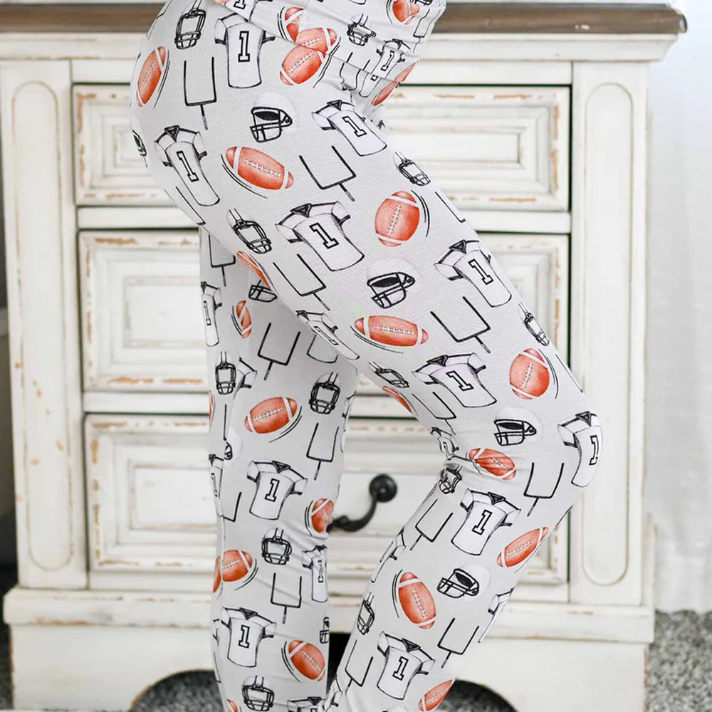 Child wearing a sports-themed pajamas 