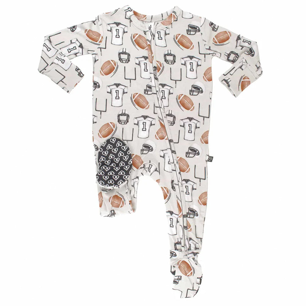 Baby onesie with sports-themed print on a white background