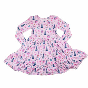 Pink children's dress with festive pattern on a white background