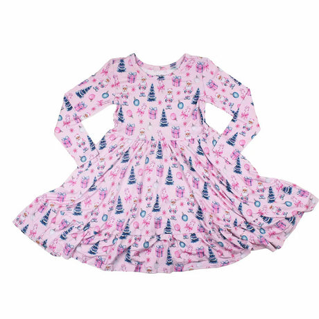 Pink children's dress with festive pattern on a white background