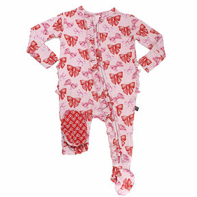 Pink baby onesie with red bow pattern on a white background