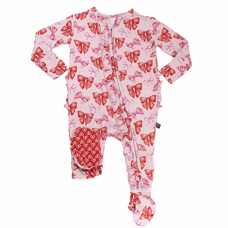 Pink baby onesie with red bow pattern on a white background