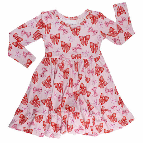 Pink dress with red bow pattern on a white background