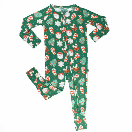 Christmas-themed children's onesie with Santa Claus, reindeer, and candy cane pattern on a green background.