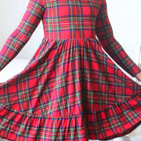 Red plaid dress with long sleeves on a white background