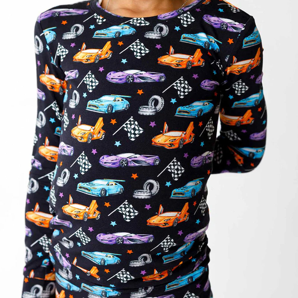 Long-sleeve shirt with colorful car pattern on a black background