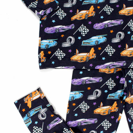 Children's pajama set with car and racing theme on a white background
