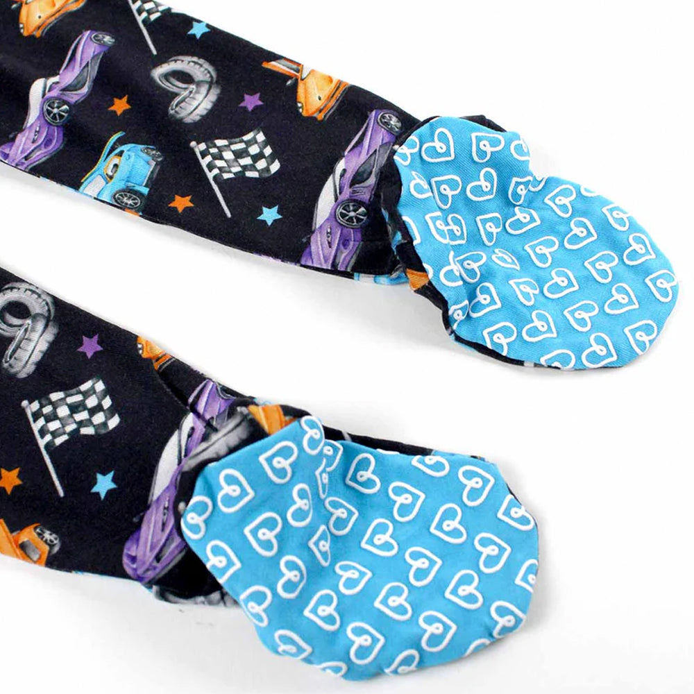Colorful socks with car and racing flag pattern on one side and blue hearts pattern on the other, displayed against a white background.