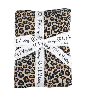 Leopard print blanket wrapped with a white ribbon labeled 'LEV baby' on a white background