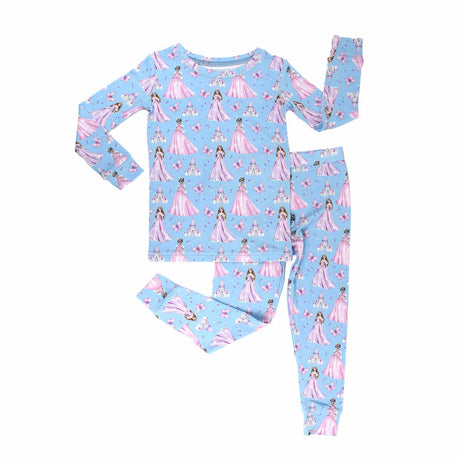Children's pajama set with princess pattern on a light blue background