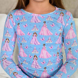 Children's long-sleeve shirt with princess and castle pattern on a blue background