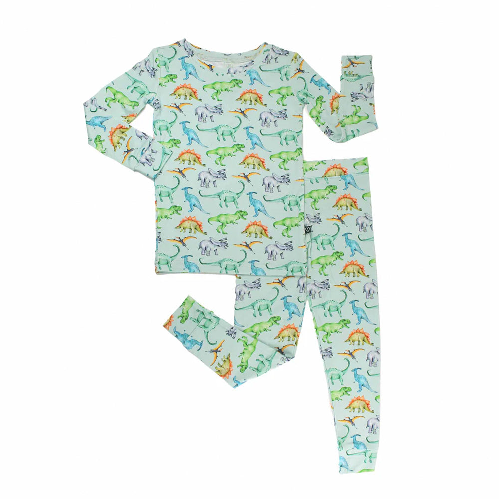 Children's pajama set with dinosaur pattern on a light blue background