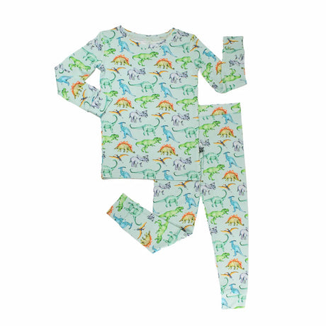 Children's pajama set with dinosaur pattern on a light blue background