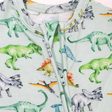 Children's onesie with dinosaur pattern on a light blue background