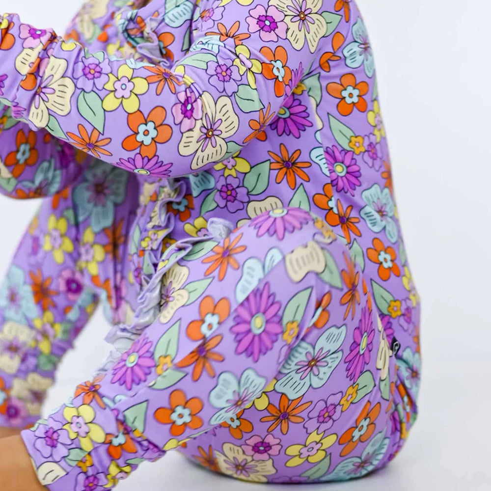 Colorful floral-patterned romper on a white background