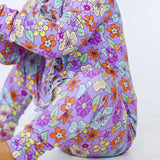 Colorful floral-patterned romper on a white background