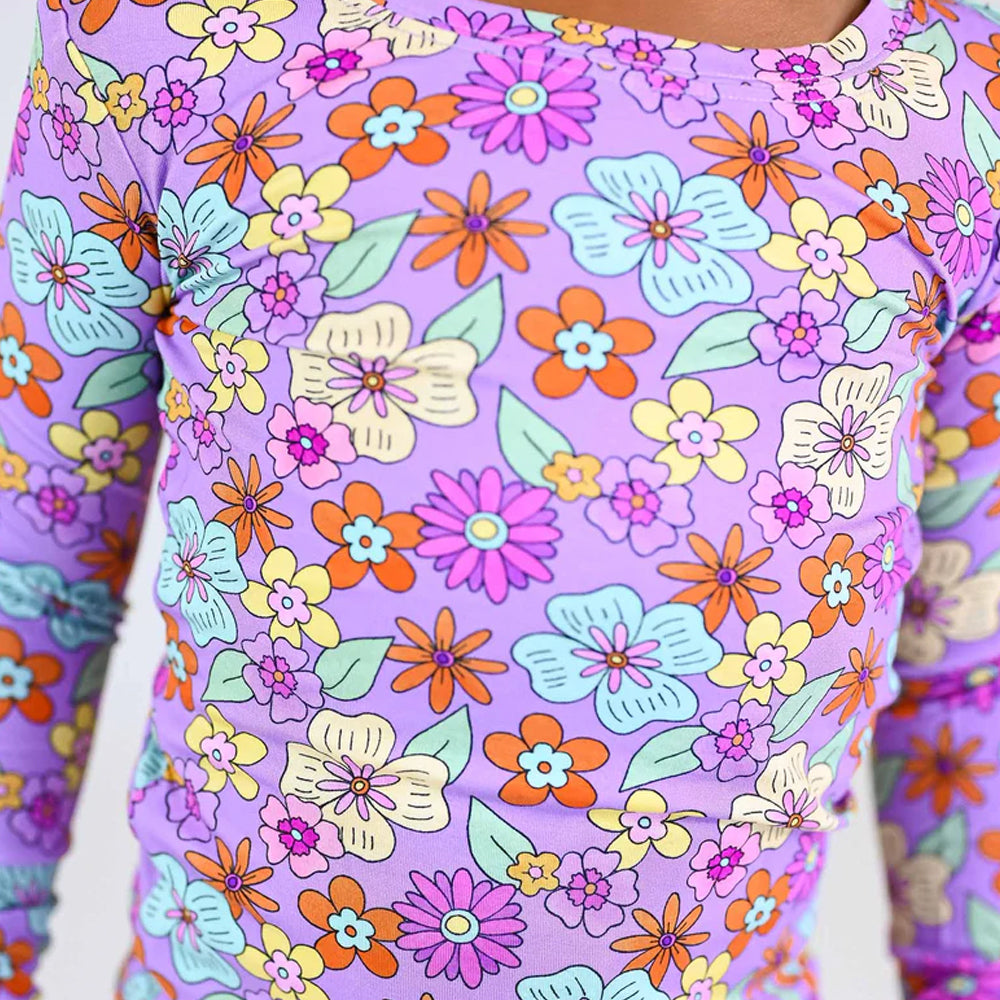 Close-up of a colorful floral pattern on a purple background