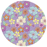 Round purple mat with colorful floral pattern on a white background