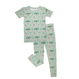 Children's pajama set with green and white pattern on a white background
