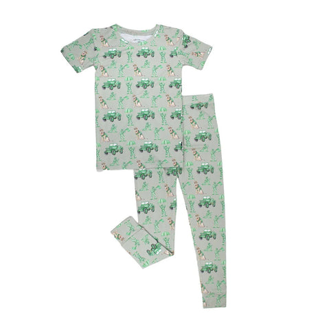 Children's pajama set with green and white pattern on a white background