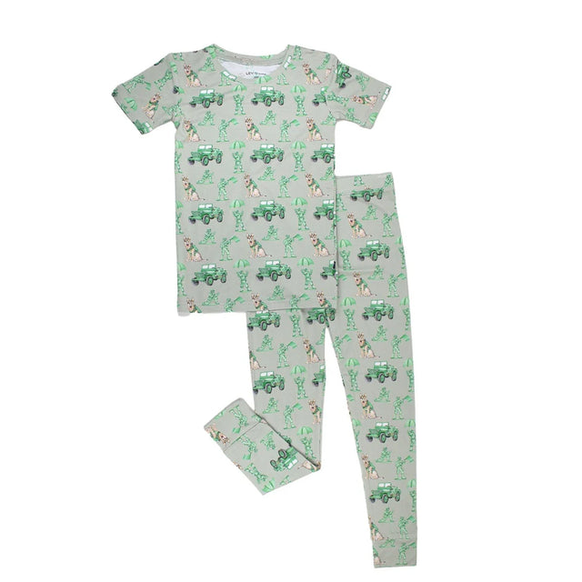Children's pajama set with green and white pattern on a white background